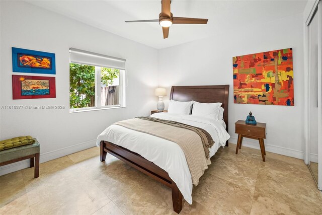 425 N Shore Dr, Miami Beach, FL 33141 - bedroom featuring baseboards and a ceiling fan