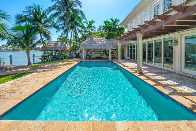 425 N Shore Dr, Miami Beach, FL 33141 - outdoor pool featuring a gazebo, a patio, a water view, and a pergola
