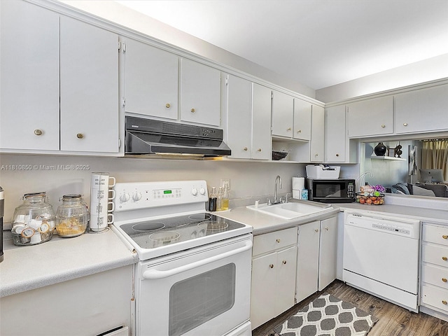 8411 Forest Hills Dr Unit 307, Coral Springs, FL 33065 - kitchen featuring white appliances, under cabinet range hood, a sink, light countertops, and wood finished floors