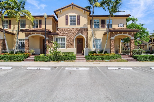 9051 SW 227th St Unit 2, Cutler Bay, FL 33190 - multi unit property featuring stucco siding, stone siding, uncovered parking, and a tile roof