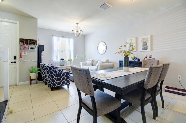 9051 SW 227th St Unit 2, Cutler Bay, FL 33190 - dining space with light tile patterned flooring and a chandelier