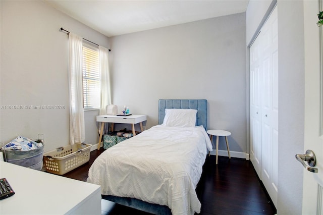 9051 SW 227th St Unit 2, Cutler Bay, FL 33190 - bedroom featuring dark wood finished floors, baseboards, and a closet