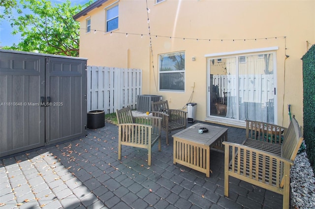 9051 SW 227th St Unit 2, Cutler Bay, FL 33190 - view of patio / terrace with an outdoor hangout area and central AC unit
