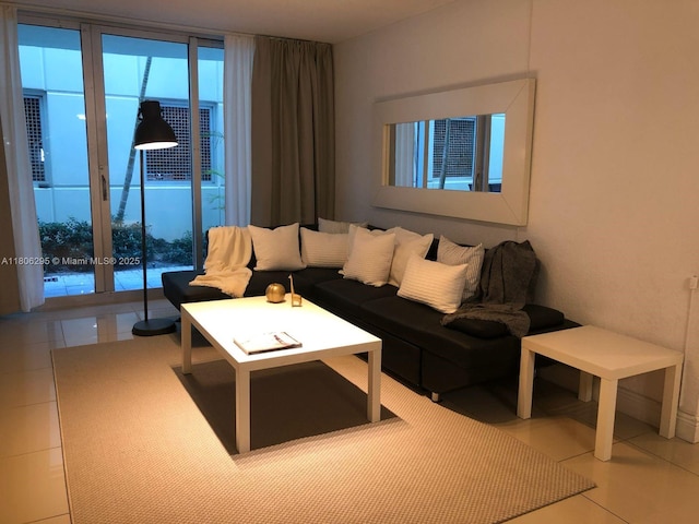 3901 S Ocean Dr Unit 1B, Hollywood, FL 33019 - tiled living room featuring healthy amount of natural light and french doors