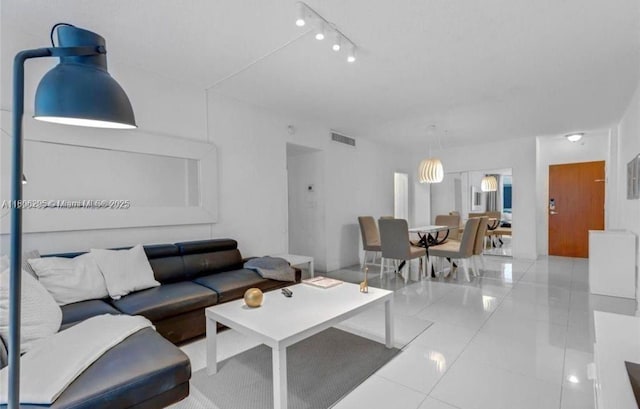 3901 S Ocean Dr Unit 1B, Hollywood, FL 33019 - living room featuring track lighting and tile patterned flooring
