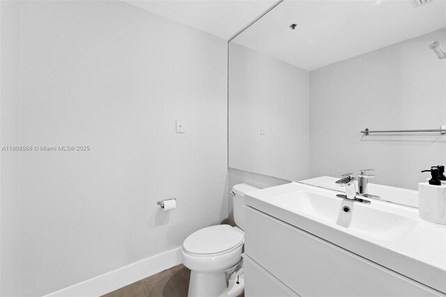 3245 NE 184th St Unit 13402, Aventura, FL 33160 - bathroom featuring vanity, toilet, and baseboards