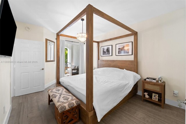 3245 NE 184th St Unit 13402, Aventura, FL 33160 - bedroom featuring access to exterior, baseboards, and wood finished floors