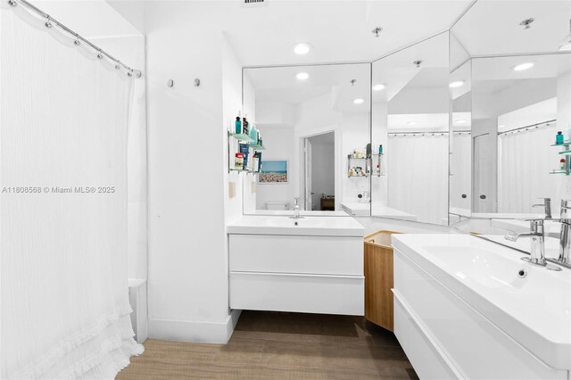 3245 NE 184th St Unit 13402, Aventura, FL 33160 - bathroom featuring wood finished floors, vanity, and recessed lighting