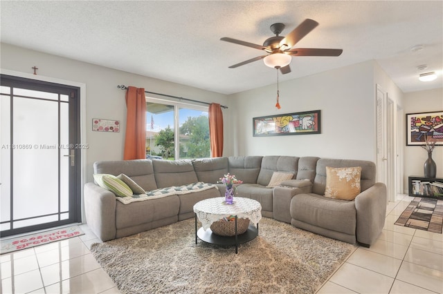 5723 NW 69th Ave, Tamarac, FL 33321 - living area featuring light tile patterned floors, ceiling fan, and a textured ceiling