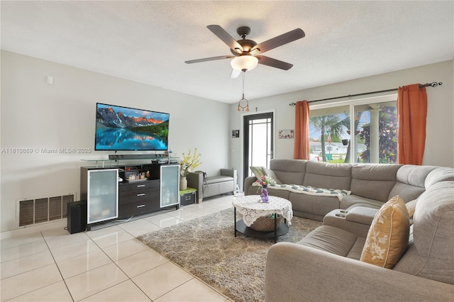 5723 NW 69th Ave, Tamarac, FL 33321 - living room featuring light tile patterned floors, a ceiling fan, and a textured ceiling