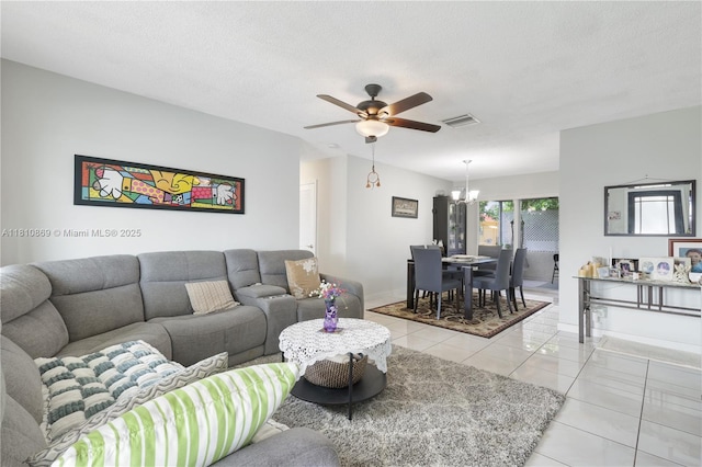 5723 NW 69th Ave, Tamarac, FL 33321 - living area with a chandelier, ceiling fan, light tile patterned flooring, baseboards, and a textured ceiling