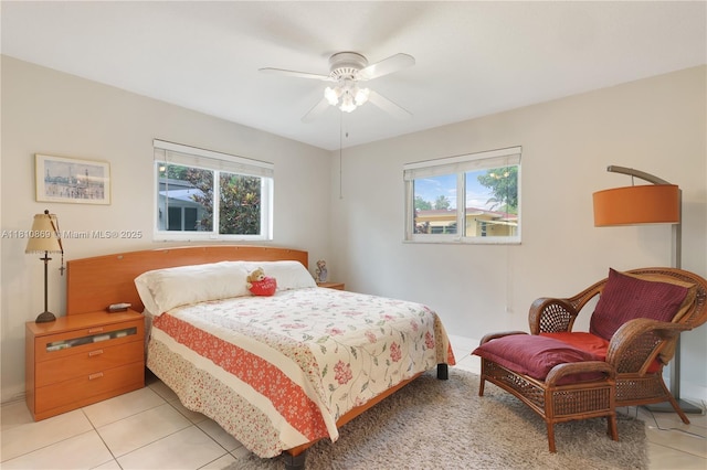5723 NW 69th Ave, Tamarac, FL 33321 - bedroom featuring multiple windows, light tile patterned flooring, and a ceiling fan