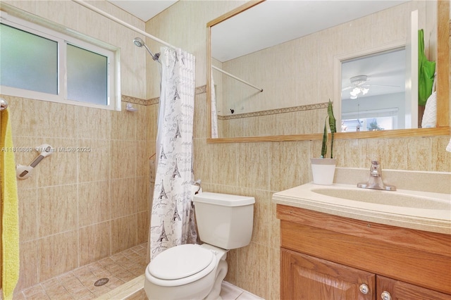 5723 NW 69th Ave, Tamarac, FL 33321 - bathroom with toilet, vanity, tile walls, tiled shower, and a ceiling fan