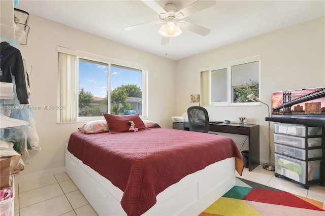 5723 NW 69th Ave, Tamarac, FL 33321 - tiled bedroom with baseboards and a ceiling fan