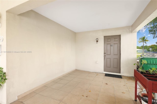 5723 NW 69th Ave, Tamarac, FL 33321 - doorway to property with stucco siding