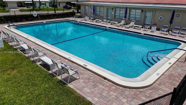 5723 NW 69th Ave, Tamarac, FL 33321 - community pool featuring a patio area and a yard