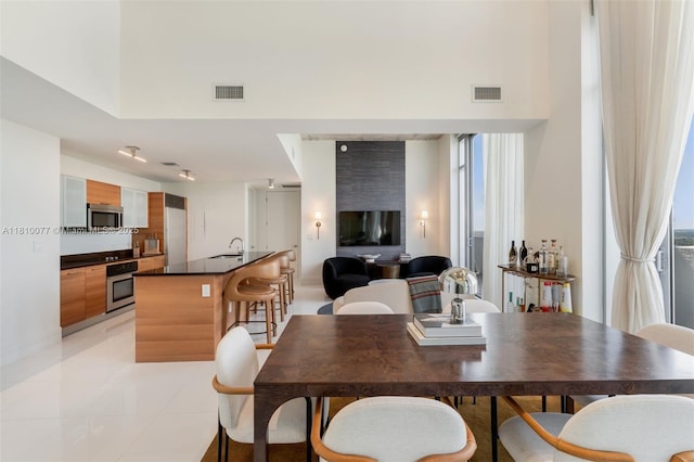 3301 NE 1st Ave Unit Ph7, Miami, FL 33137 - dining space featuring light tile patterned floors