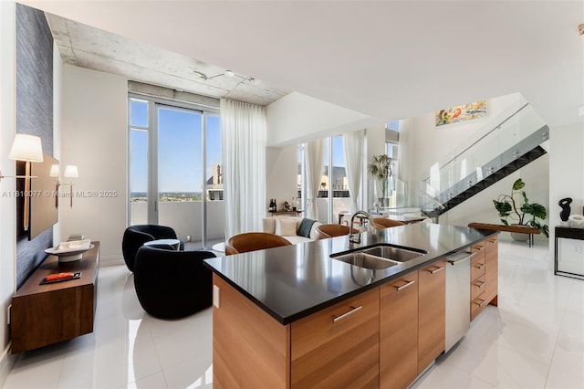 3301 NE 1st Ave Unit Ph7, Miami, FL 33137 - kitchen with a sink, open floor plan, dark countertops, modern cabinets, and a center island with sink
