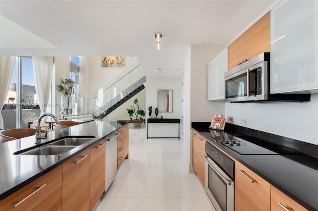 3301 NE 1st Ave Unit Ph7, Miami, FL 33137 - kitchen featuring stainless steel appliances, a sink, dark countertops, and modern cabinets