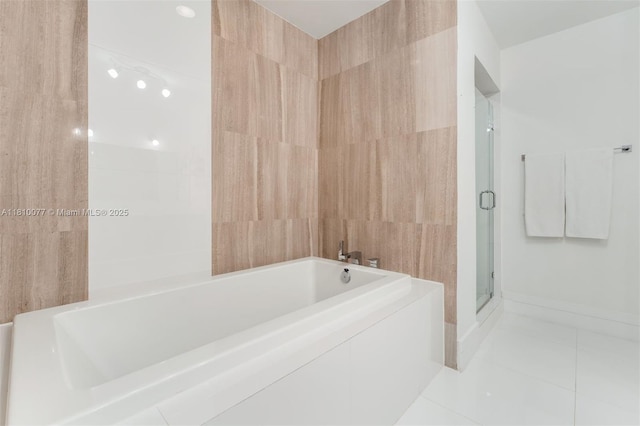 3301 NE 1st Ave Unit Ph7, Miami, FL 33137 - full bath with tile patterned flooring, a bath, a stall shower, and baseboards