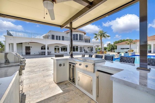 4610 SW 178th Ave, Southwest Ranches, FL 33331 - view of patio featuring wine cooler, an outdoor pool, a ceiling fan, and a balcony