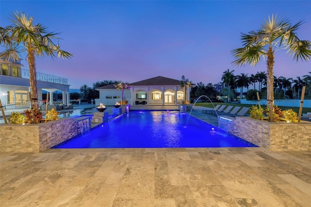 4610 SW 178th Ave, Southwest Ranches, FL 33331 - pool at dusk featuring an outdoor pool, a patio, an exterior structure, and an outdoor structure