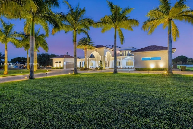 4610 SW 178th Ave, Southwest Ranches, FL 33331 - mediterranean / spanish house featuring a front lawn, concrete driveway, and stucco siding
