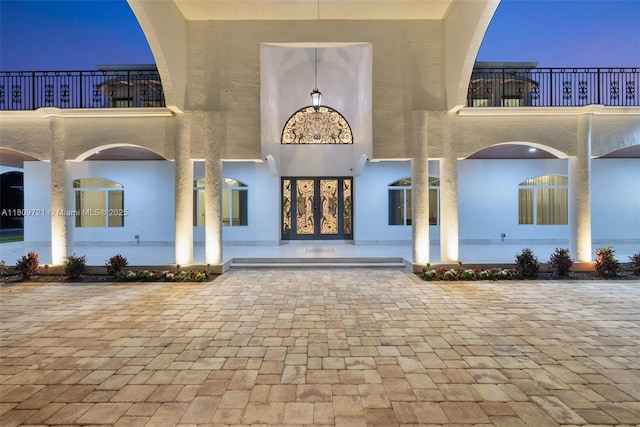 4610 SW 178th Ave, Southwest Ranches, FL 33331 - doorway to property featuring stucco siding and a balcony
