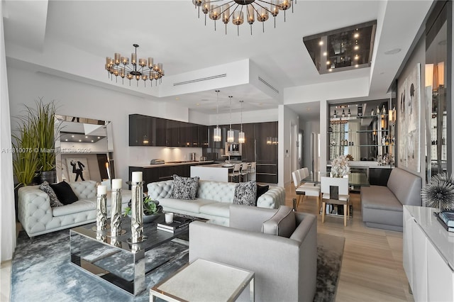 3250 NE 188th St Unit Uph08, Aventura, FL 33180 - living area featuring a chandelier and light wood-type flooring