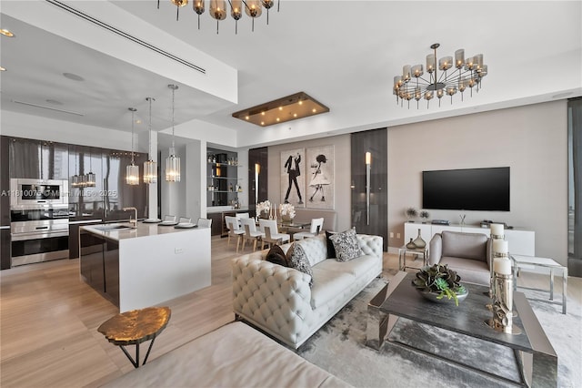 3250 NE 188th St Unit Uph08, Aventura, FL 33180 - living room with a chandelier, built in features, light wood finished floors, and recessed lighting