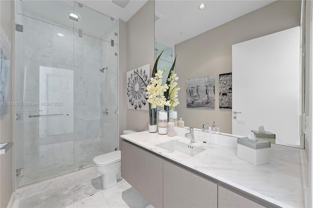 3250 NE 188th St Unit Uph08, Aventura, FL 33180 - bathroom with toilet, vanity, a shower stall, marble finish floors, and recessed lighting