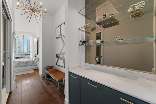 3250 NE 188th St Unit Uph08, Aventura, FL 33180 - bar area featuring dark wood finished floors and a chandelier