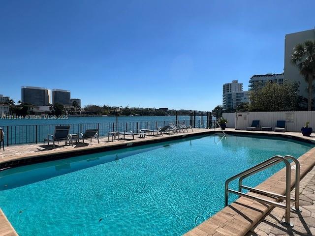 10101 E Bay Harbor Dr Unit 401, Bay Harbor Islands, FL 33154 - community pool featuring a city view