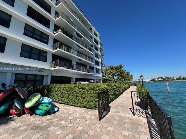 10101 E Bay Harbor Dr Unit 401, Bay Harbor Islands, FL 33154 - view of apartment building / complex with a water view