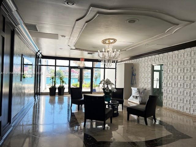 10101 E Bay Harbor Dr Unit 401, Bay Harbor Islands, FL 33154 - lobby with wallpapered walls and expansive windows