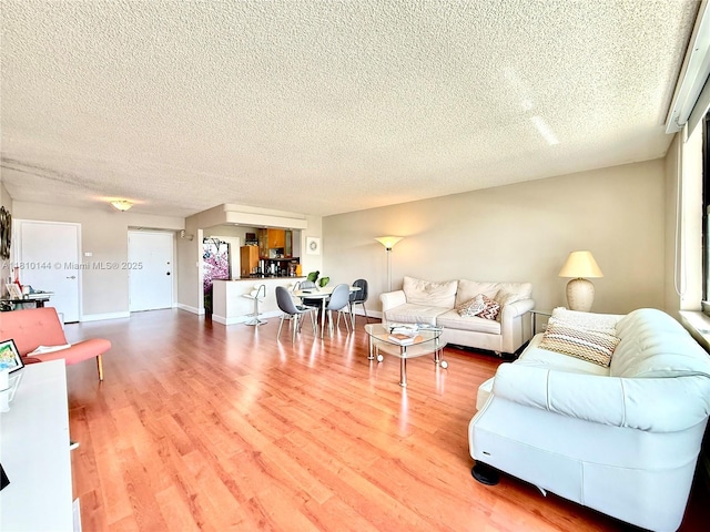 10101 E Bay Harbor Dr Unit 401, Bay Harbor Islands, FL 33154 - living room with a textured ceiling and wood finished floors