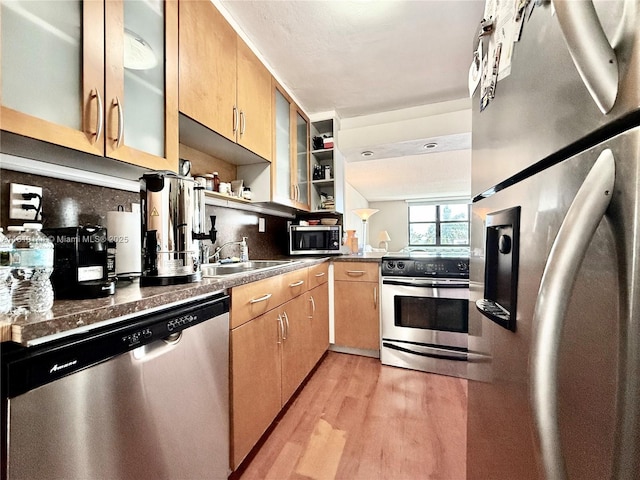 10101 E Bay Harbor Dr Unit 401, Bay Harbor Islands, FL 33154 - kitchen with stainless steel appliances, open shelves, light wood finished floors, dark countertops, and light brown cabinetry