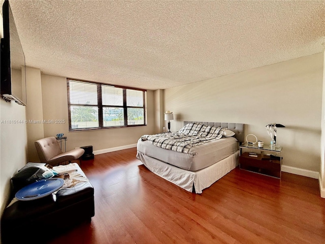 10101 E Bay Harbor Dr Unit 401, Bay Harbor Islands, FL 33154 - bedroom featuring a textured ceiling and wood finished floors