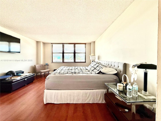 10101 E Bay Harbor Dr Unit 401, Bay Harbor Islands, FL 33154 - bedroom featuring wood finished floors and a textured ceiling