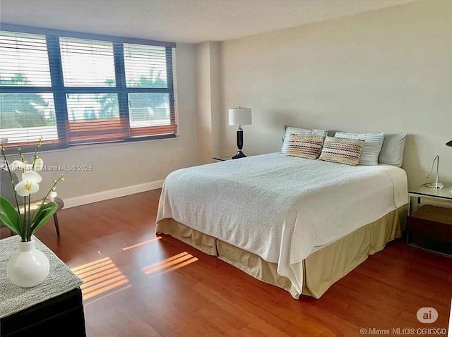 10101 E Bay Harbor Dr Unit 401, Bay Harbor Islands, FL 33154 - bedroom featuring baseboards and wood finished floors