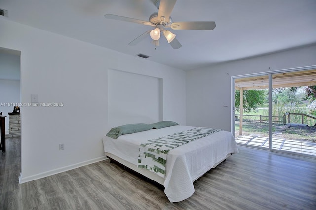 100 Honeysuckle Ln, Lake Placid, FL 33852 - bedroom with access to exterior, wood finished floors, ceiling fan, and baseboards