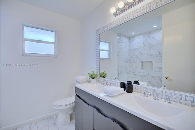 100 Honeysuckle Ln, Lake Placid, FL 33852 - full bath with marble finish flooring, double vanity, toilet, a shower, and baseboards