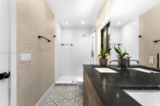4250 Bay Point Rd, Miami, FL 33137 - full bathroom featuring double vanity, a shower stall, toilet, tile patterned flooring, and baseboards