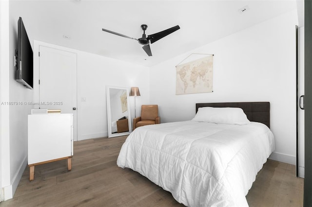 4250 Bay Point Rd, Miami, FL 33137 - bedroom with wood finished floors, baseboards, and ceiling fan