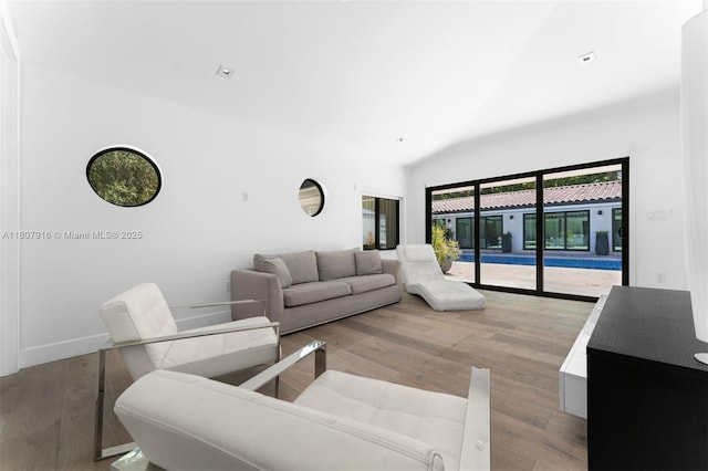 4250 Bay Point Rd, Miami, FL 33137 - living area featuring light wood-type flooring and high vaulted ceiling