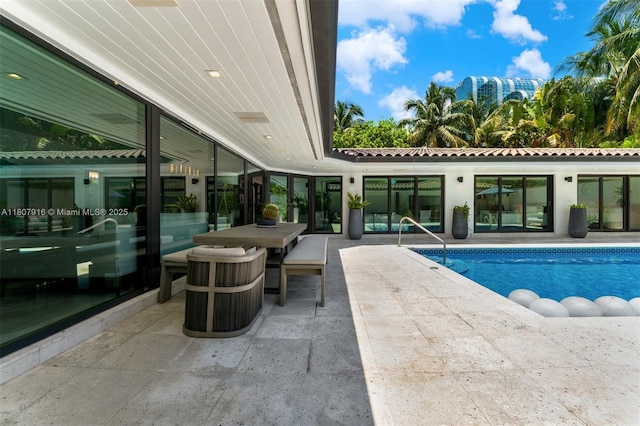 4250 Bay Point Rd, Miami, FL 33137 - swimming pool featuring a patio and outdoor dining area