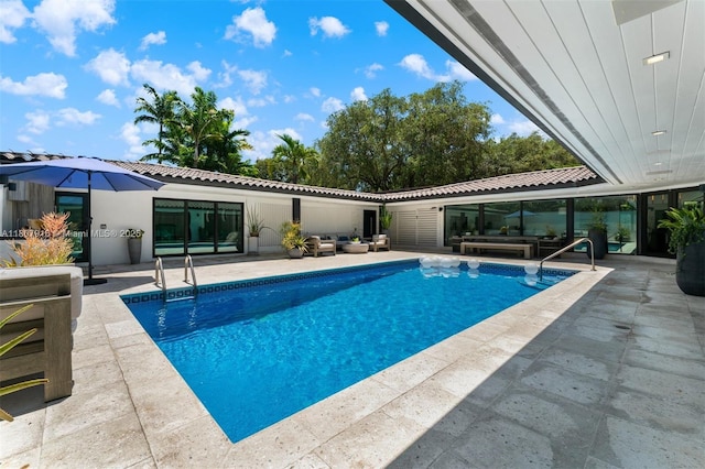 4250 Bay Point Rd, Miami, FL 33137 - swimming pool with a patio and an outdoor hangout area