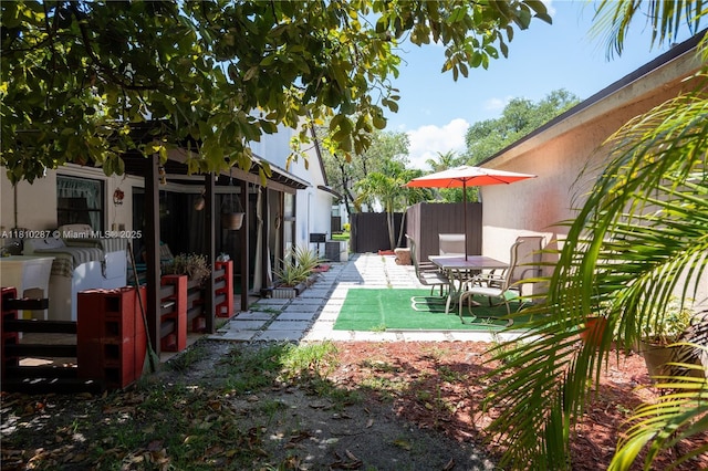 13284 SW 108th St Cir, Miami, FL 33186 - view of yard with a patio area