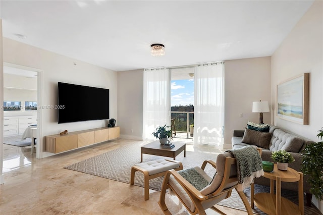 14951 Royal Oaks Ln Unit 901, North Miami, FL 33181 - living area featuring baseboards