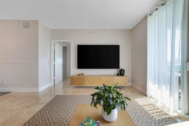 14951 Royal Oaks Ln Unit 901, North Miami, FL 33181 - living room with plenty of natural light and baseboards